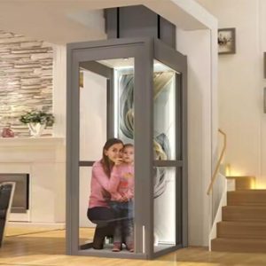 A home lift featuring glass panels with a woman and child inside, installed in a modern interior near staircase.