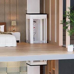 Shaftless home elevator installed in a modern home interior with a bedroom visible.