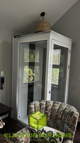 It's a residential home elevator  installed in the corner of a two-story house.