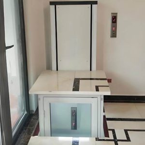 a white home elevator installed inside a home corner