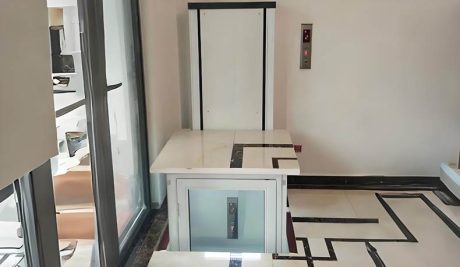 a white home elevator installed inside a home corner