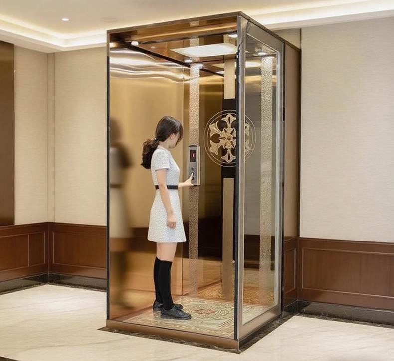 a golden frame mini home lift with a lady stand inside the cabin. 