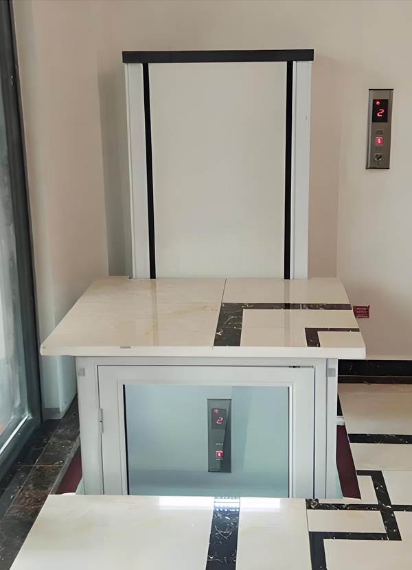 Safety lid to cover the hole when elevator is not on this floor.