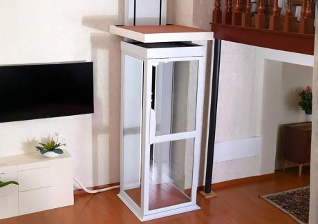 a white frame home elevator installed in a modern home