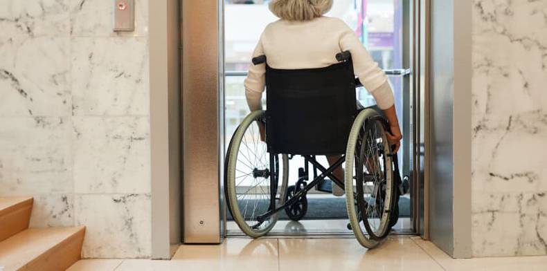 a wheelchair goes into a elevator