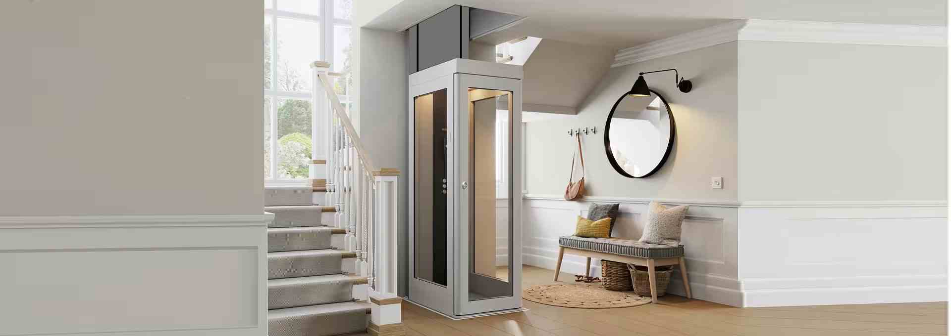 A modern residential home elevator installed in a home interior near a staircase.