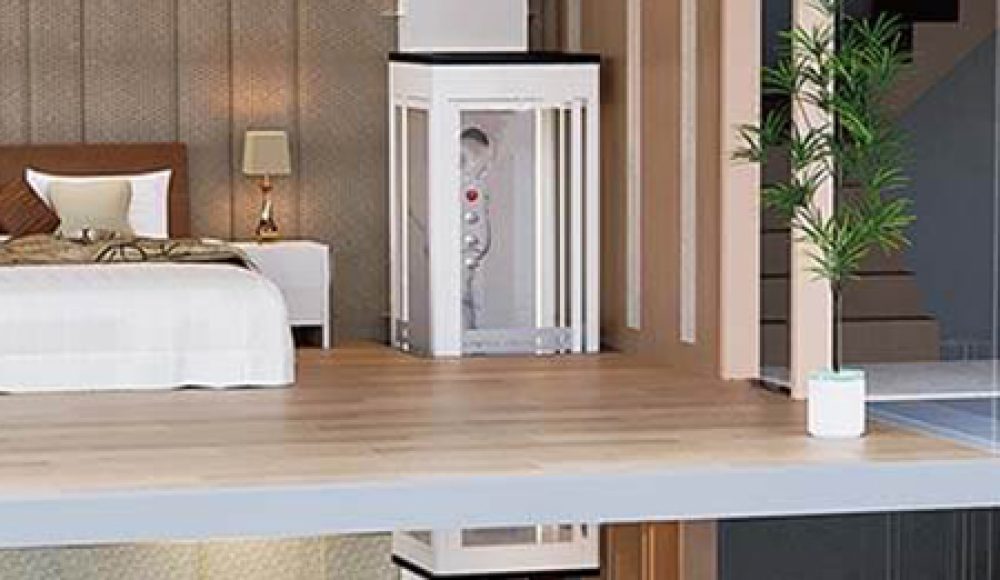 Shaftless home elevator installed in a modern home interior with a bedroom visible.